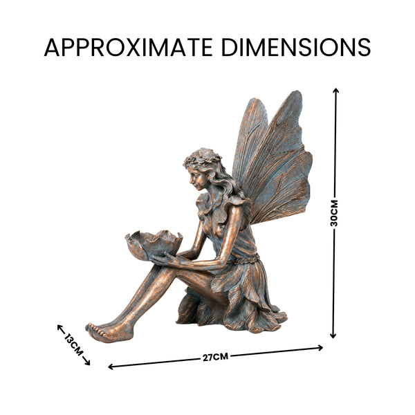 Winged fairy resin statue holding a daisy
