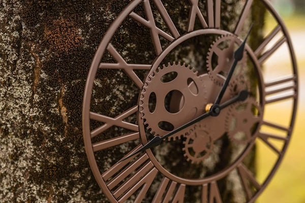 Skeleton clock with clear Roman numeral markers