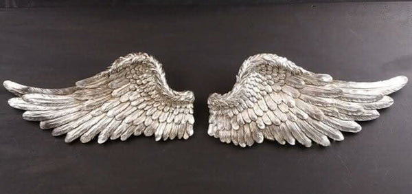 Small resin angel wings with detailed feather texture