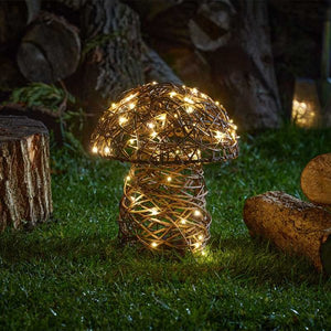 Small mushroom LED light displayed in an autumn garden