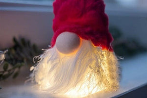 Red Christmas gonk with subtle lighting