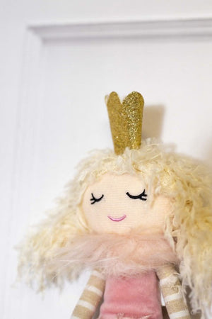 Whimsical seated Christmas fairy with pink colouring
