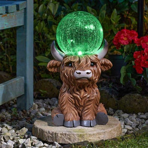 Hand painted Highland cow garden decoration outdoors