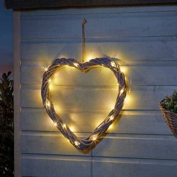 Solar LED firefly heart ornament with woven detailing