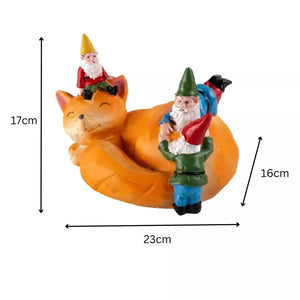 Whimsical sleeping fox solar ornament for flower beds