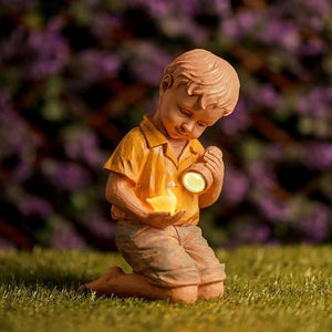 Solar boy and duck garden ornament with LED flashlight