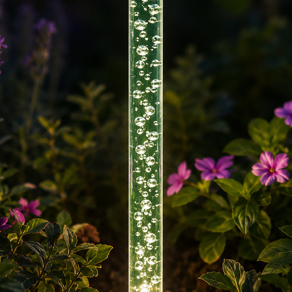 Eight bubble lights arranged around a garden border