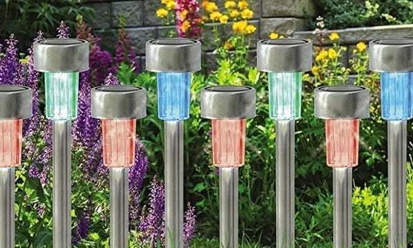 Solar colour changing garden stake lights along pathway