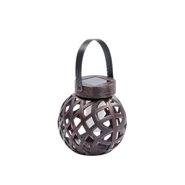 Rustic metal light hanging from a garden hook