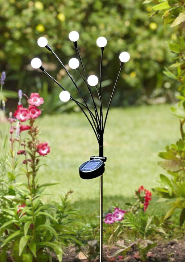 Garden stake light creating decorative evening illumination
