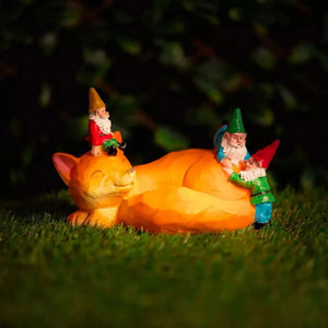 Solar-powered sleeping fox garden ornament