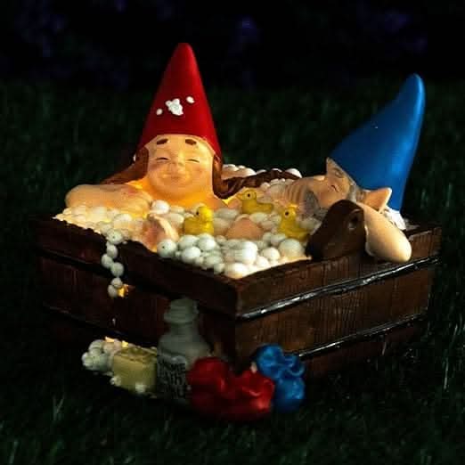 Solar gnome bathtub garden ornament