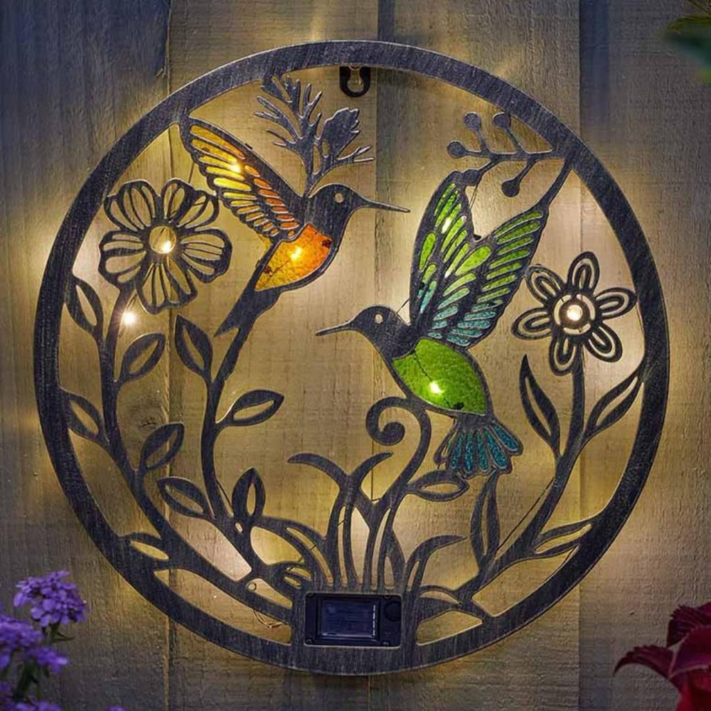 Solar hummingbird wall light with stained glass effect.