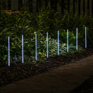 Solar panel connected to eight decorative garden lights