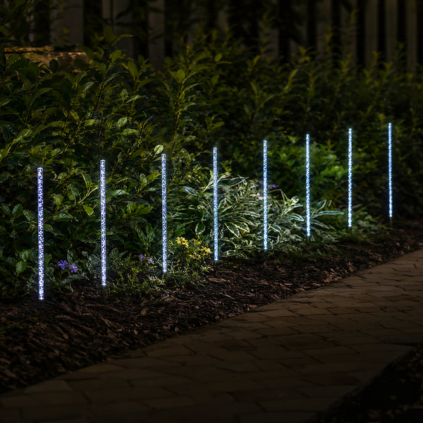 Solar panel connected to eight decorative garden lights