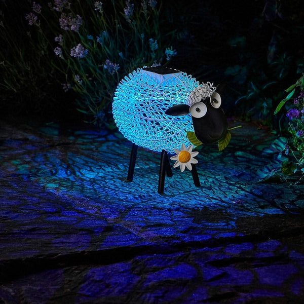 Solar powered sheep silhouette displayed on lawn