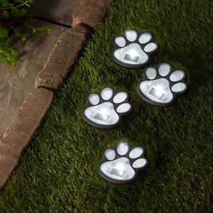 Four solar pet paw print garden stake lights