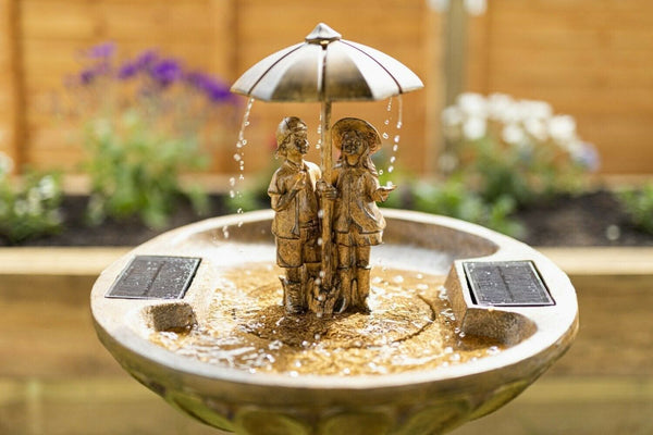 Bronze effect water feature displayed on a patio
