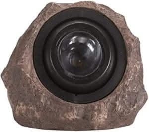 Solar powered rock spotlight displayed outdoors