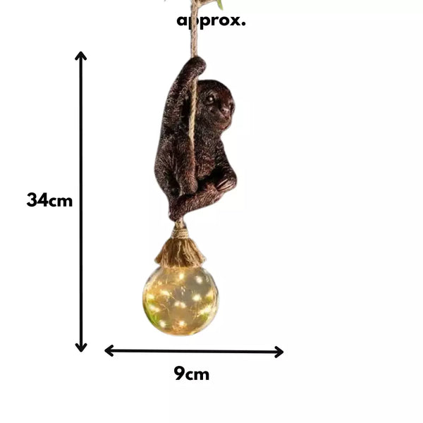 Solar sloth garden light hanging from rope