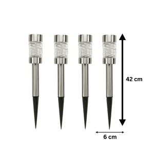 Solar stake lights with faceted glass lenses