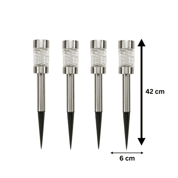 Solar stake lights with faceted glass lenses