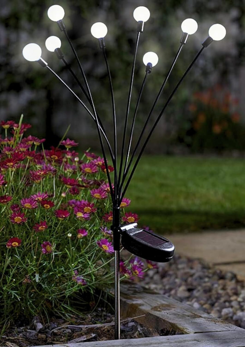 Solar starburst garden light with flexible LED flower stems