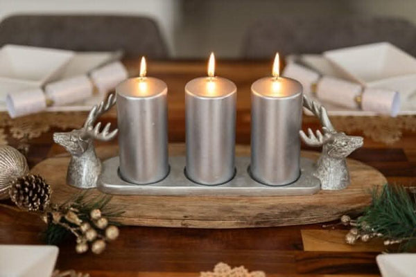 Silver candle centrepiece displayed on a dining table