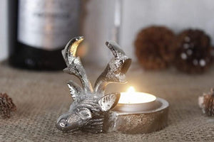 Decorative stag head candle holder displayed indoors