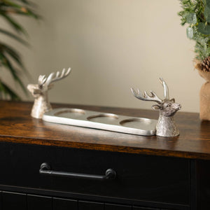 Three candle holder styled on a dining table