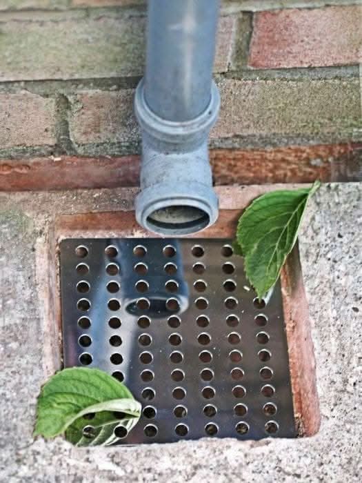 Square stainless steel drain cover with swirl design