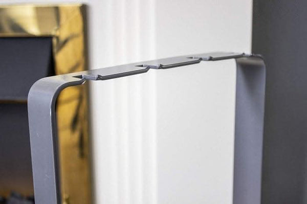 Freestanding silver fireplace tools shown together