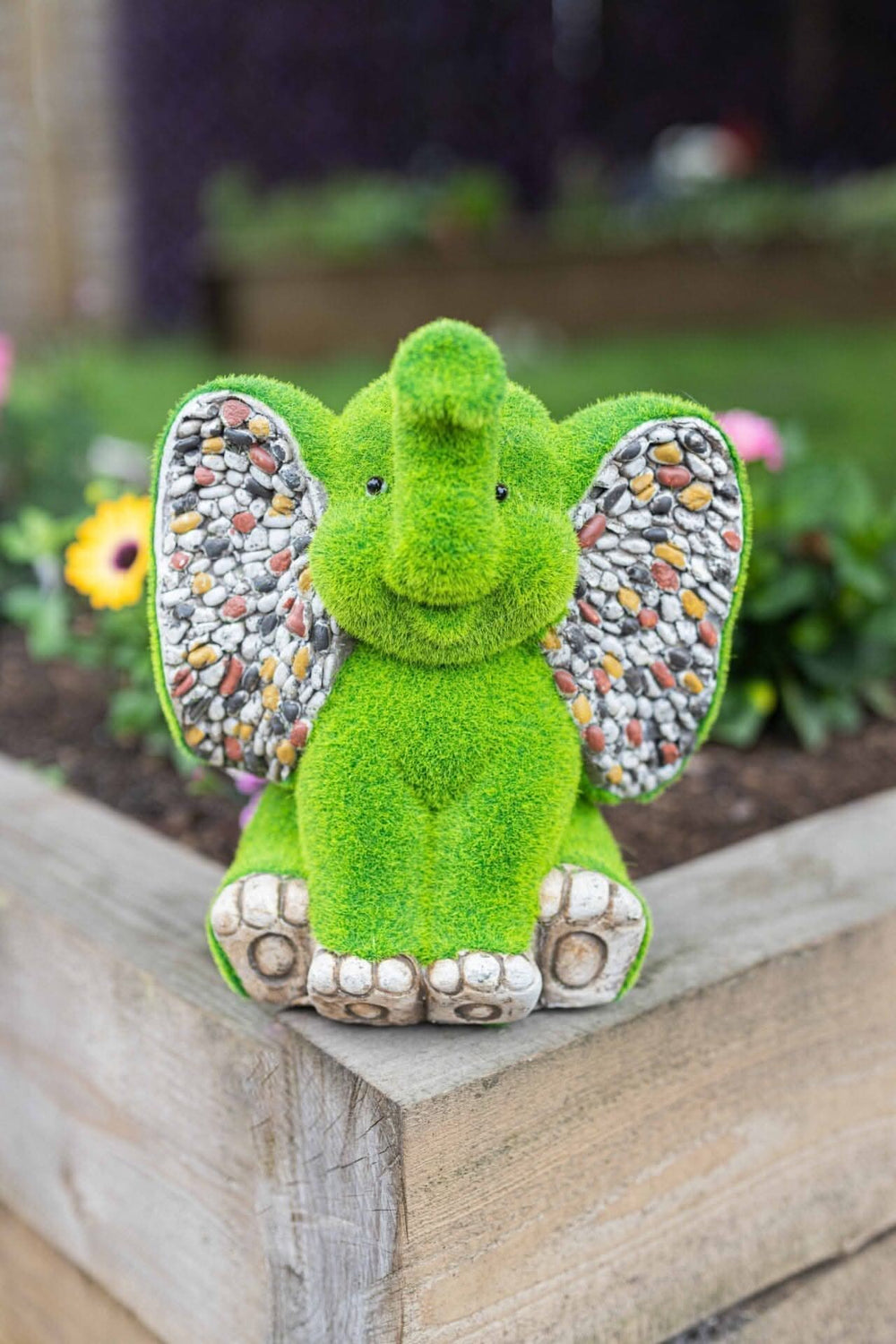 Stone and grass effect elephant garden ornament