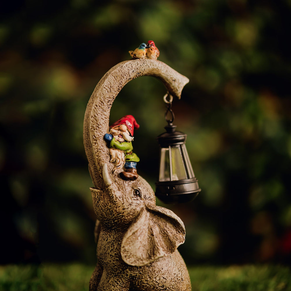 Solar elephant gnome garden ornament with glowing LED lantern