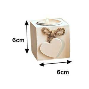 Tea light candles displayed inside wooden holders