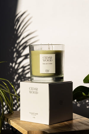 Cedarwood soy candle styled on a home side table