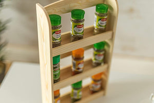 Tiered spice rack displaying seasoning jars
