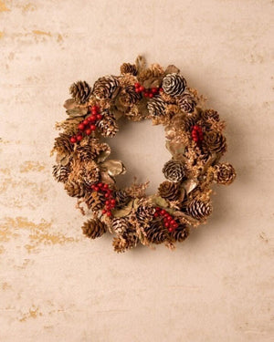 Red berry Christmas wreath displayed as seasonal home decor