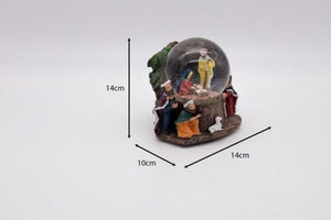 Traditional Christmas nativity snow globe shown indoors