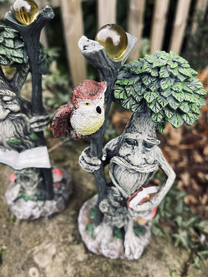 Whimsical tree face wall décor for cottage gardens