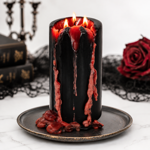 Vampire themed candle displayed on a Halloween table