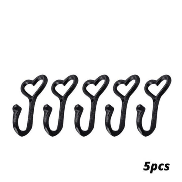 Set of five black heart-shaped hooks on a white background