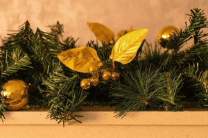 Gold festive garland with poinsettia flowers