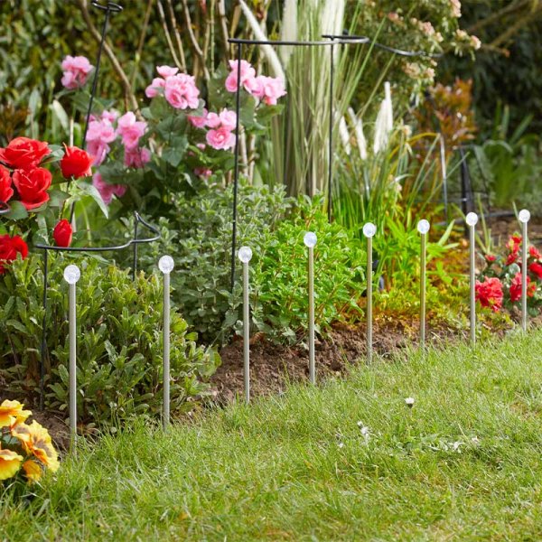 Bubble globe solar lights illuminating a garden pathway