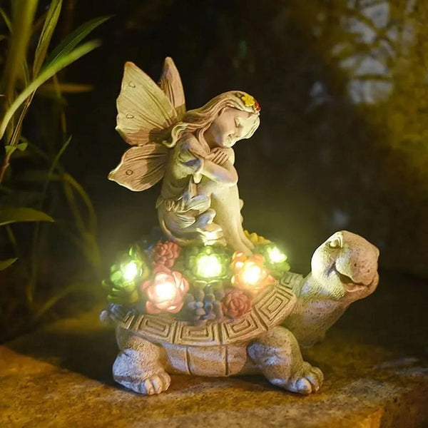 Solar LED tortoise ornament illuminated at night