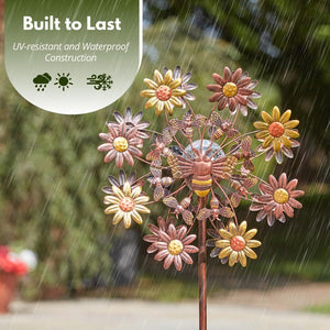 Garden windmill with rotating metal blades.