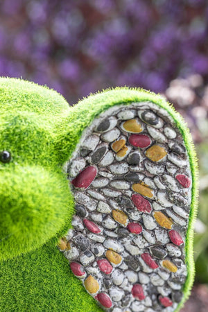 Decorative elephant with artificial grass body