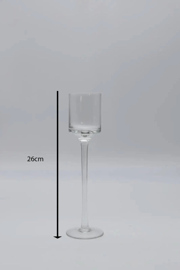 Three glass candle holders arranged as centrepiece