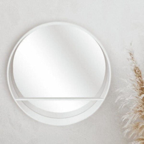 White wall mirror styled with decorative ornaments