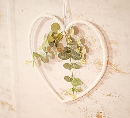 Botanical heart wreath displayed against a door